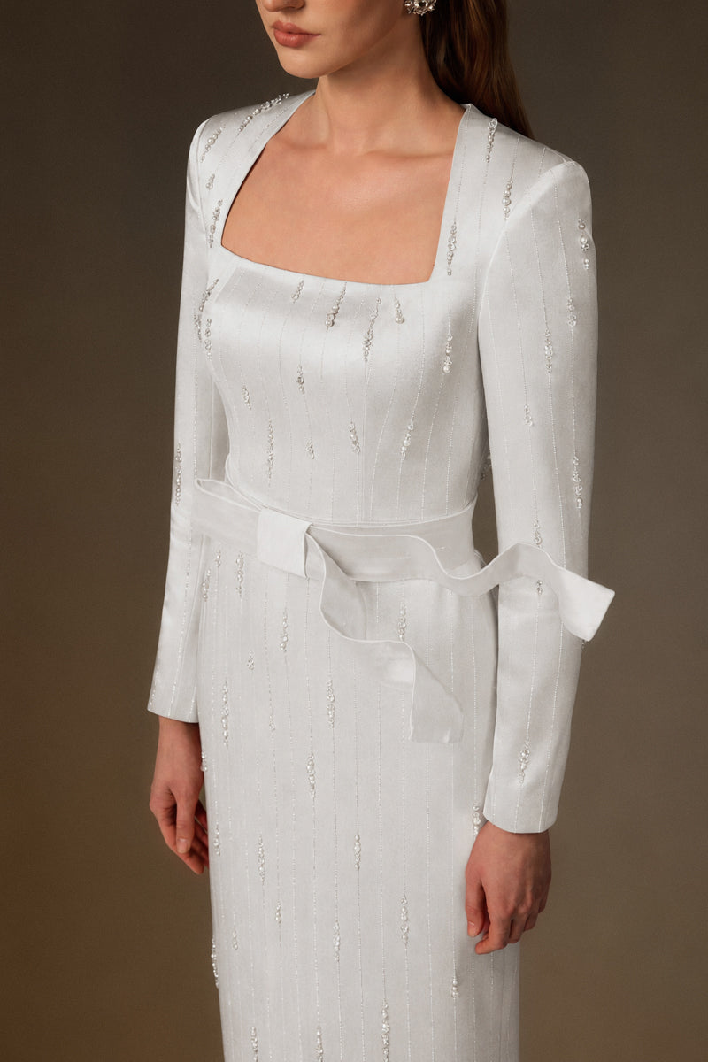 Trapeze Neck Column Gown With Belt Resembling A Wind-Blown Train In White Metallic Striped Silk