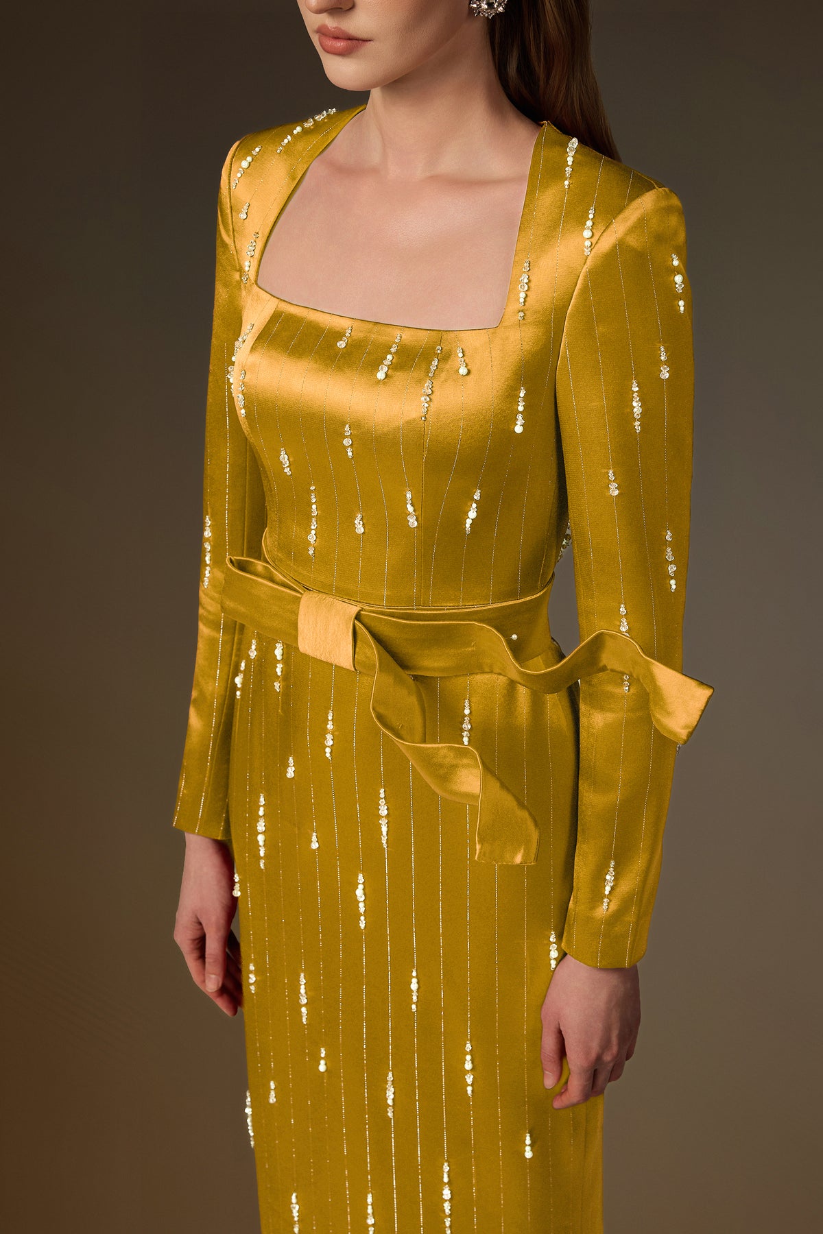 Trapeze Neck Column Gown With Belt Resembling A Wind-Blown Train In Yellow Metallic Striped Silk