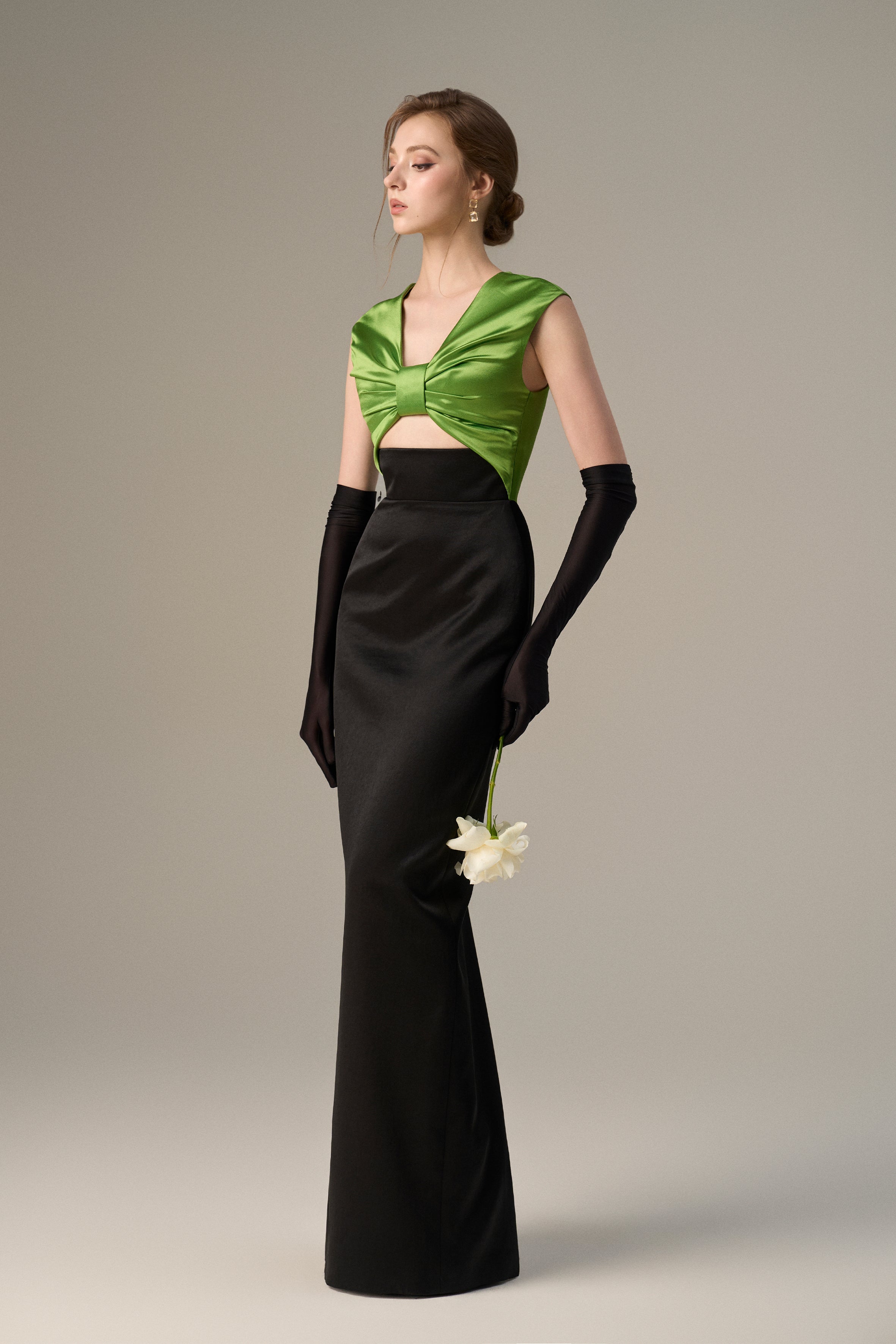 Black Taffeta Gown With A Statement Bow, Cut-out, And Satin Silk Accents