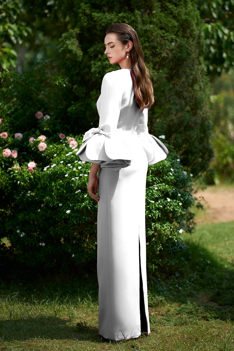 COLUMN EVENING GOWN WITH TRAPEZE NECKLINE AND ROSE DRAPED THREE-QUARTER SLEEVES
