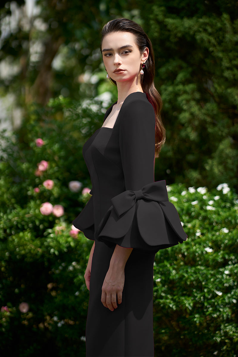 COLUMN EVENING GOWN WITH TRAPEZE NECKLINE AND ROSE DRAPED THREE-QUARTER SLEEVES