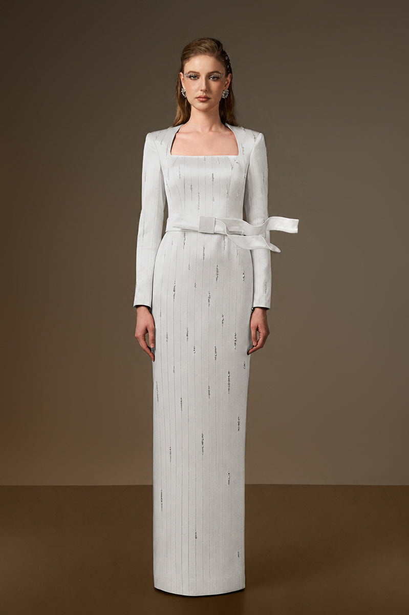 Trapeze Neck Column Gown With Belt Resembling A Wind-Blown Train In White Metallic Striped Silk