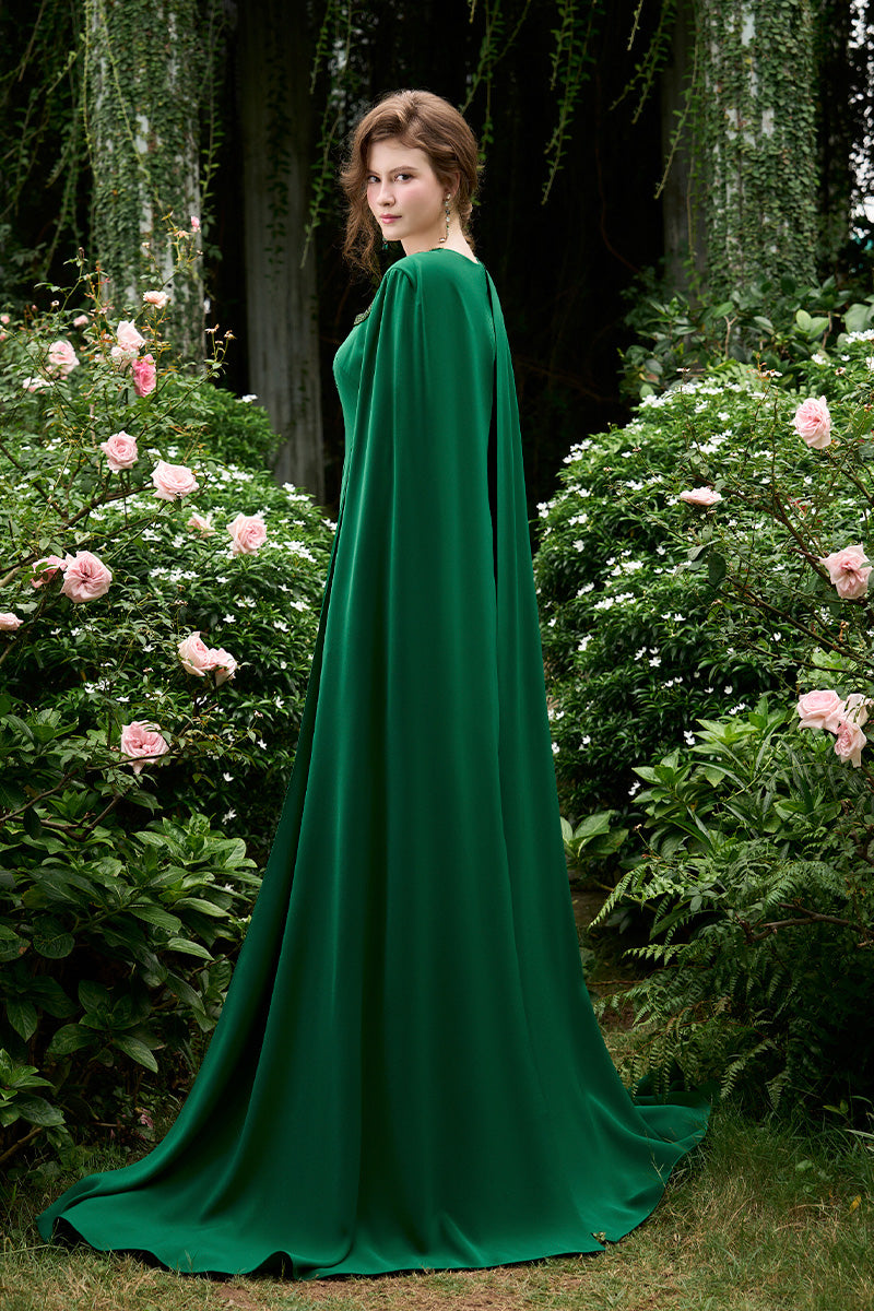 Column Evening Gown With Trapeze Neckline And Attached Long Cape