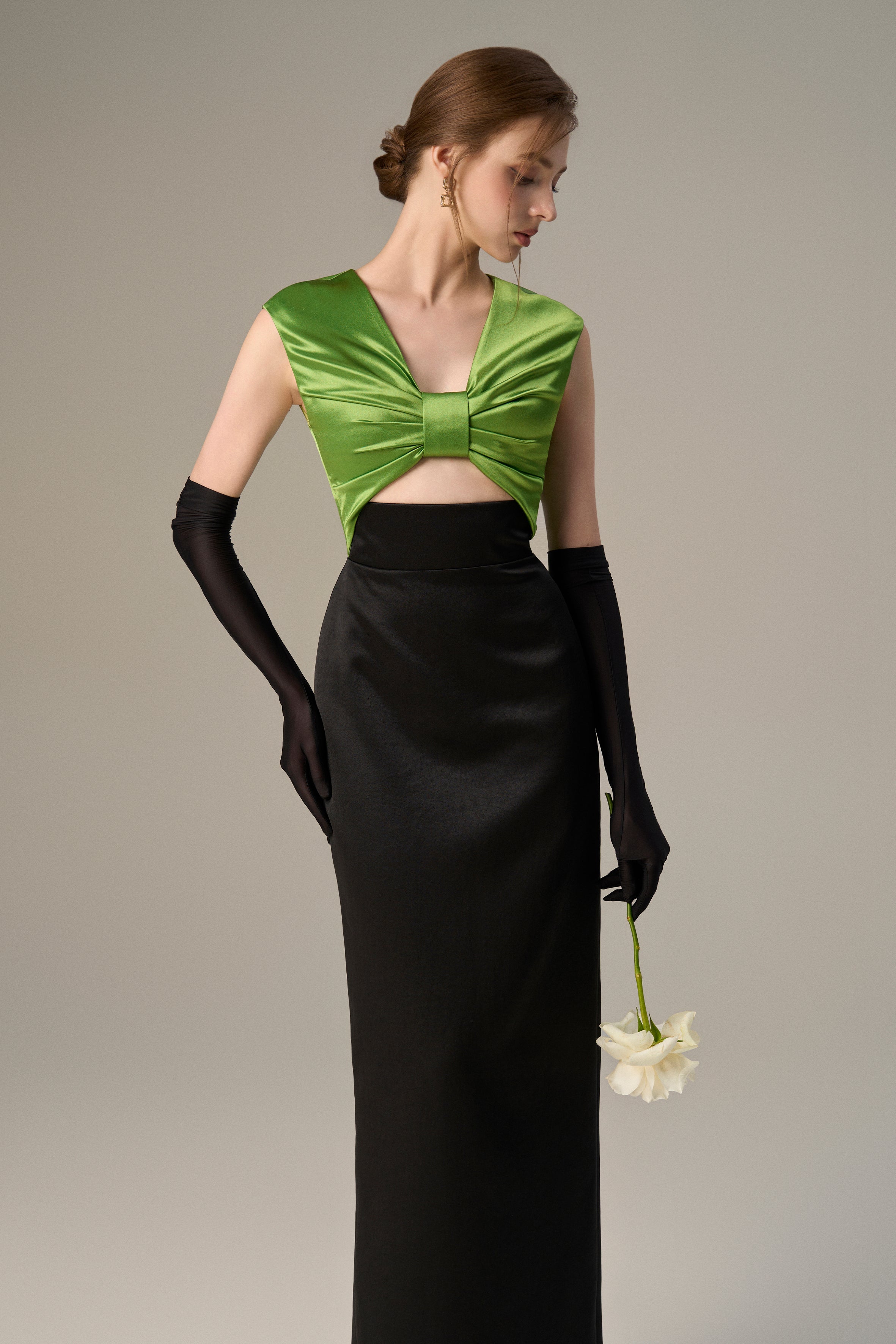 Black Taffeta Gown With A Statement Bow, Cut-out, And Satin Silk Accents